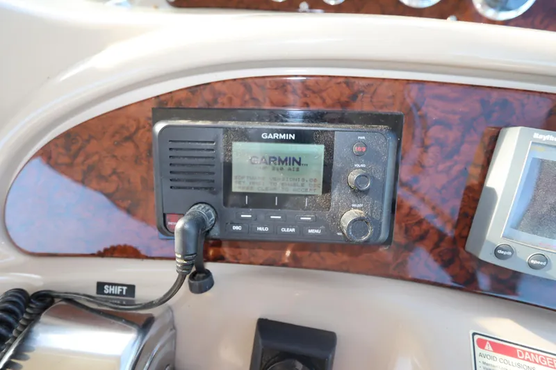 Slide: The Image of Garmin marine radio on 2000 Sea Ray 460 Sundancer dashboard. - 27