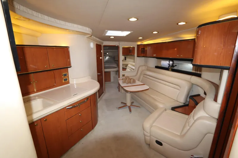Slide: The Image of Luxurious interior of 2000 Sea Ray 460 Sundancer yacht with elegant seating and cabinetry. - 32