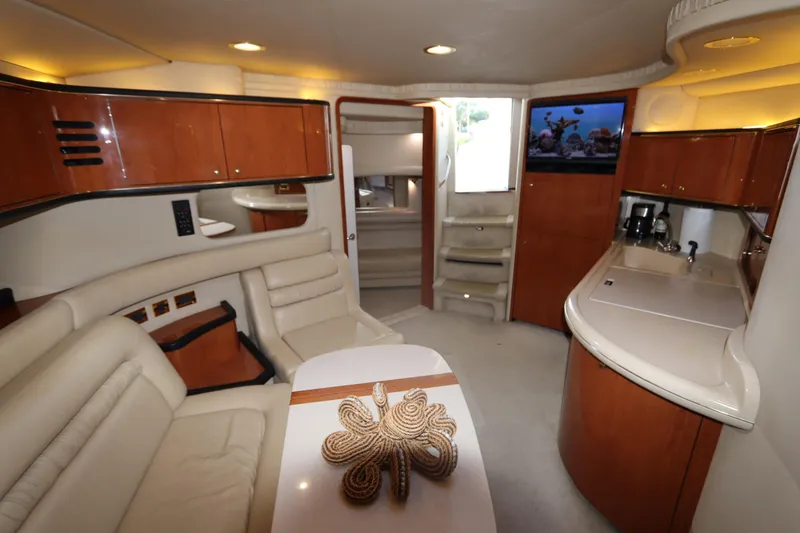 Slide: The Image of Luxurious interior of 2000 Sea Ray 460 Sundancer yacht with modern amenities. - 34