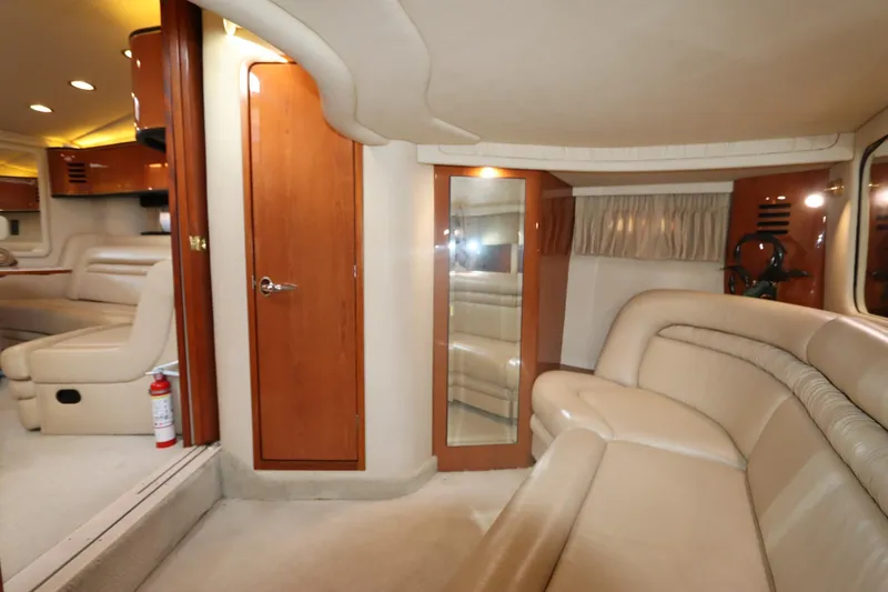 Slide: The Image of Luxurious interior of a 2000 Sea Ray 460 Sundancer yacht with beige leather seating. - 37