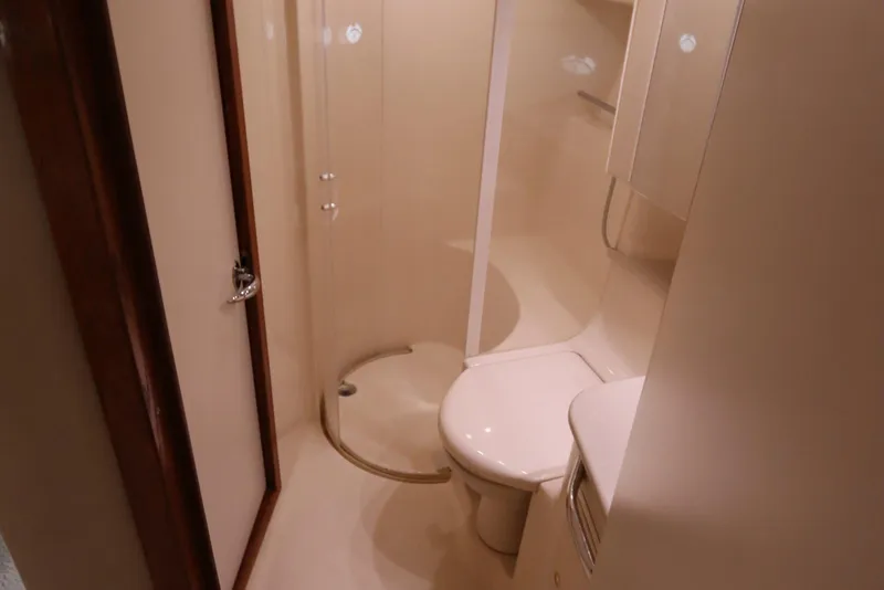 Slide: The Image of Bathroom interior of 2000 Sea Ray 460 Sundancer yacht, featuring shower and toilet. - 39