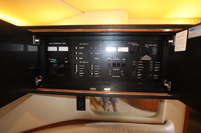 Slide: The Image of Electrical control panel inside 2000 Sea Ray 460 Sundancer yacht cabin. - 42