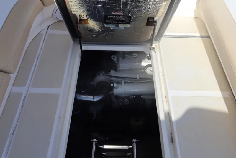 Slide: The Image of Engine compartment of a 2000 Sea Ray 460 Sundancer yacht, showcasing mechanical components. - 44