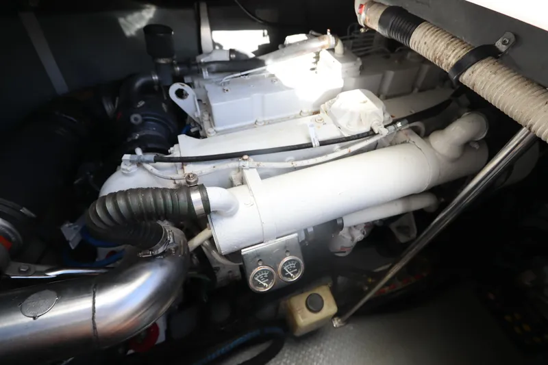 Slide: The Image of Engine compartment of a 2000 Sea Ray 460 Sundancer yacht, showcasing mechanical components. - 45