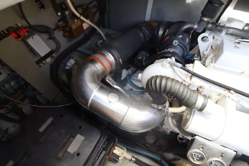 Slide: The Image of Engine compartment of a 2000 Sea Ray 460 Sundancer boat, showing pipes and gauges. - 46