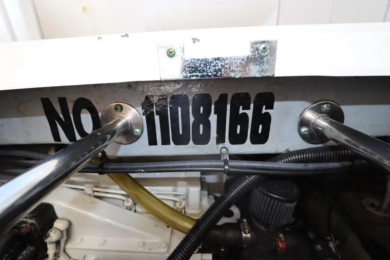 Slide: The Image of Engine compartment of 2000 Sea Ray 460 Sundancer with serial number 1108166 visible. - 48