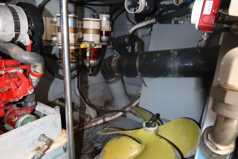 Slide: The Image of Engine room of 2000 Sea Ray 460 Sundancer with visible components and propeller. - 50