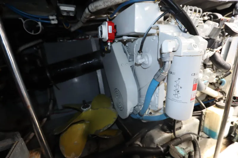 Slide: The Image of Engine room of 2000 Sea Ray 460 Sundancer with visible components and propeller. - 56