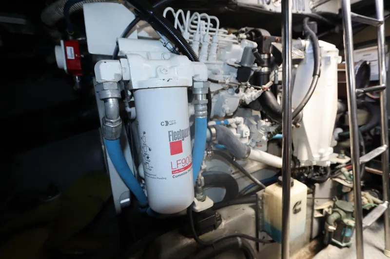 Slide: The Image of Engine room of 2000 Sea Ray 460 Sundancer with Fleetguard filter and Cummins components. - 57