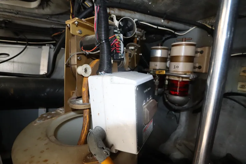 Slide: The Image of Engine room of 2000 Sea Ray 460 Sundancer with electrical components and filters. - 59