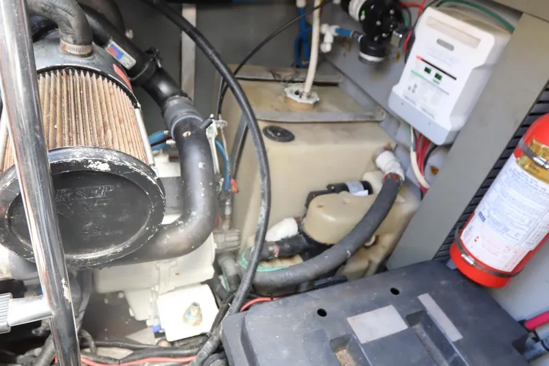 Slide: The Image of Engine compartment of a 2000 Sea Ray 460 Sundancer with visible components and fire extinguisher. - 62