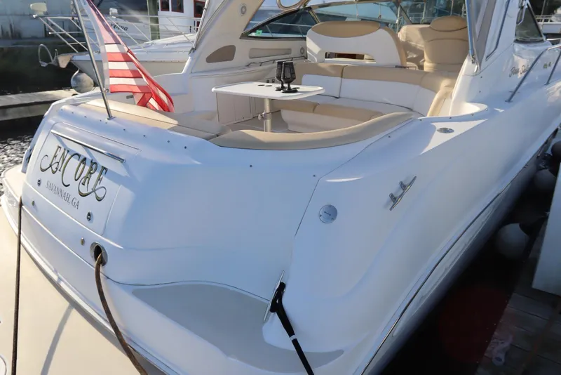 Slide: The Image of 2000 Sea Ray 460 Sundancer yacht with American flag, docked in Savannah, GA. - 9