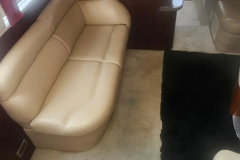 Slide: The Image of Interior of 2004 Sea Ray 480 Motor Yacht with beige leather seating. - 13