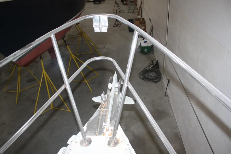 Slide: The Image of Bow of 1986 J Boats J/28 sailboat in a storage facility. - 10