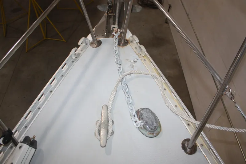 Slide: The Image of Bow of 1986 J Boats J/28 sailboat with anchor chain and cleat. - 11