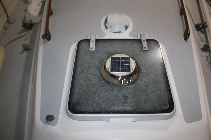 Slide: The Image of 1986 J Boats J/28 deck with solar-powered vent on hatch. - 13