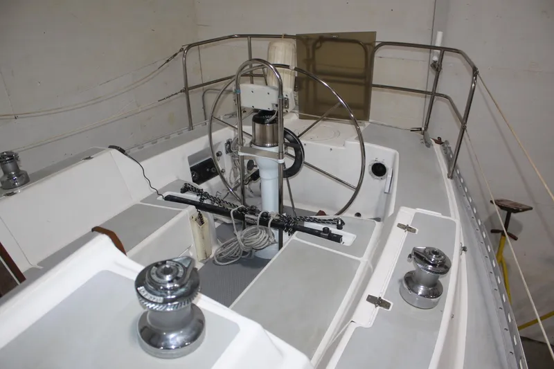 Slide: The Image of 1986 J Boats J/28 sailboat cockpit with steering wheel and winches. - 18