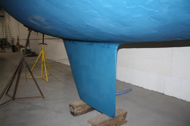Slide: The Image of 1986 J Boats J/28 sailboat keel in a workshop setting. - 22