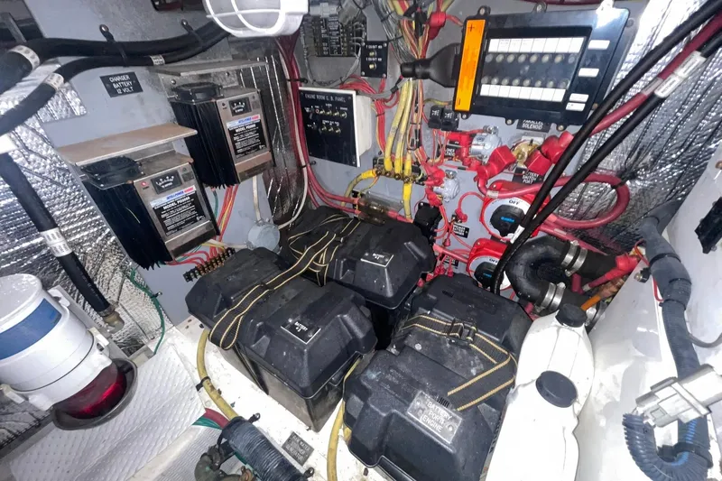 Slide: The Image of 2005 Cruisers Yachts 405 Express Motoryacht interior with white seating and marina view. - 10