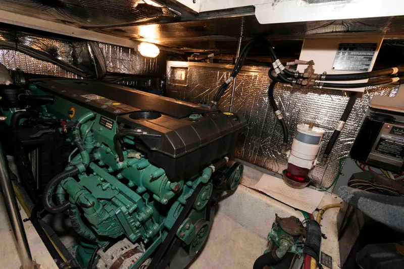 Slide: The Image of Engine room of 2005 Cruisers Yachts 405 Express Motoryacht with visible machinery and components. - 24