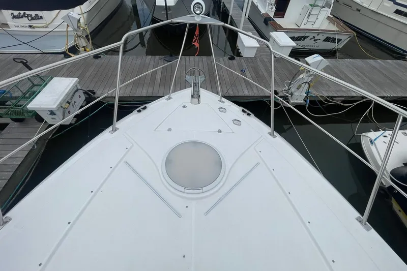 Slide: The Image of 2005 Cruisers Yachts 405 Express Motoryacht stern view with dockside access. - 4