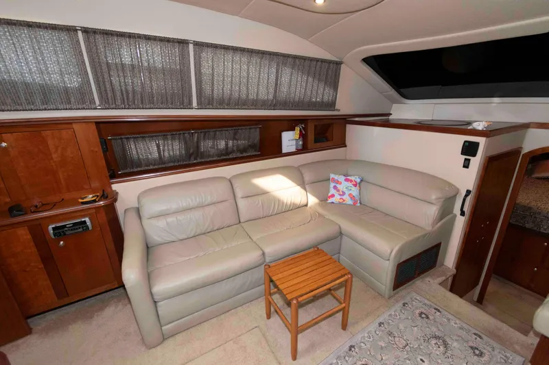 Slide: The Image of Luxurious interior of 2005 Cruisers Yachts 405 Express Motoryacht with leather seating and wooden accents. - 12