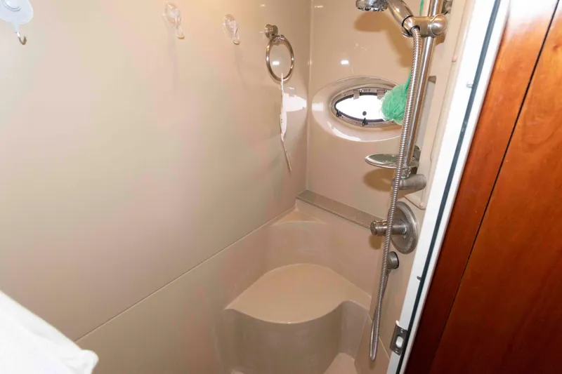 Slide: The Image of Shower area in 2005 Cruisers Yachts 405 Express Motoryacht with porthole and handheld showerhead. - 22