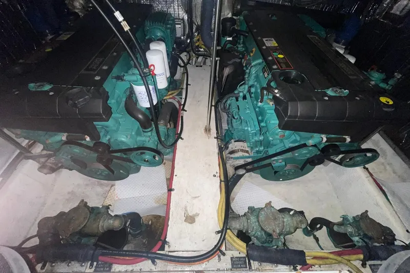 Slide: The Image of 2005 Cruisers Yachts 405 Express Motoryacht helm with white seating and control panel. - 7