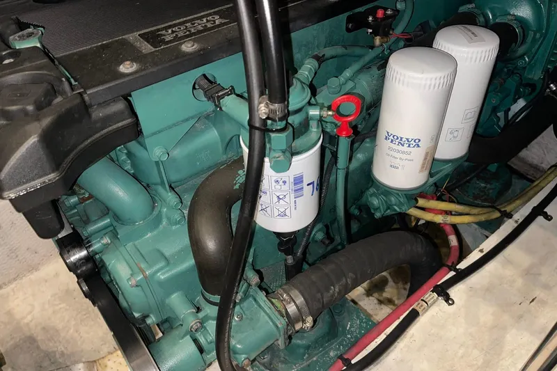 Slide: The Image of 2005 Cruisers Yachts 405 Express Motoryacht helm with modern controls and wood accents. - 8