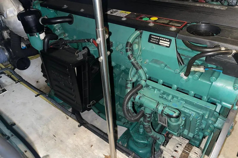 Slide: The Image of 2005 Cruisers Yachts 405 Express Motoryacht helm with wood accents and navigation instruments. - 9