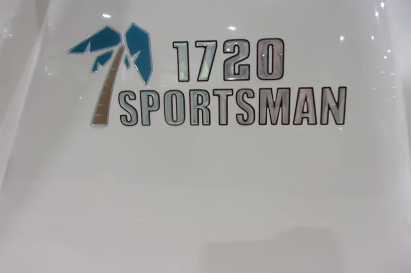 Slide: The Image of Key West 1720 Sportsman 2022 logo on boat hull, featuring palm tree design. - 10