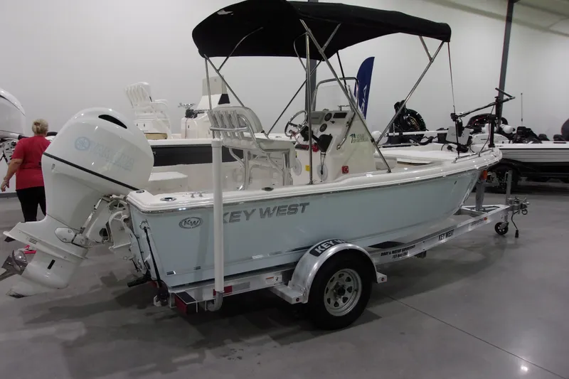Slide: The Image of 2022 Key West 1720 Sportsman boat on trailer in showroom. - 21