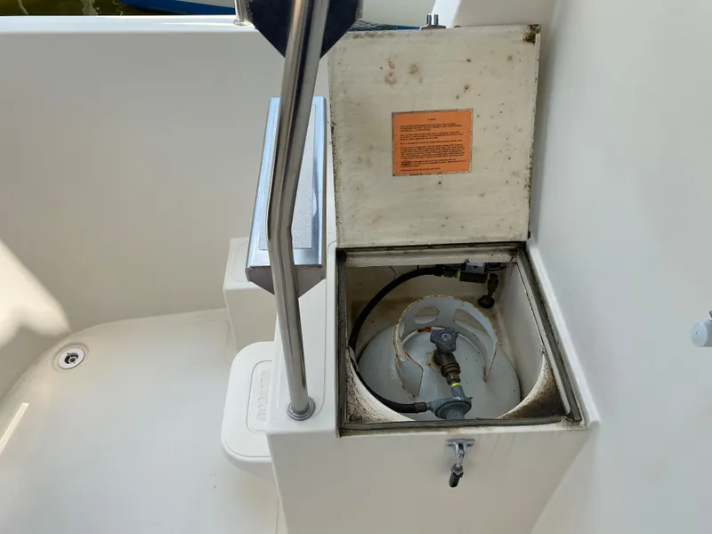 Slide: The Image of Open storage compartment on 1998 Camano Troll 31 boat deck. - 26