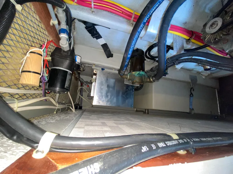 Slide: The Image of Engine compartment of a 1998 Camano Troll 31 boat, showing wiring and components. - 33