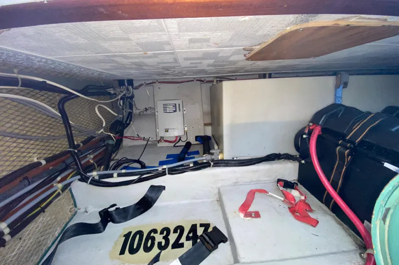 Slide: The Image of 1998 Camano Troll 31 engine compartment with wiring and equipment. - 34