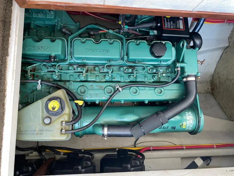 Slide: The Image of Engine compartment of a 1998 Camano Troll 31 with a Volvo marine engine. - 39
