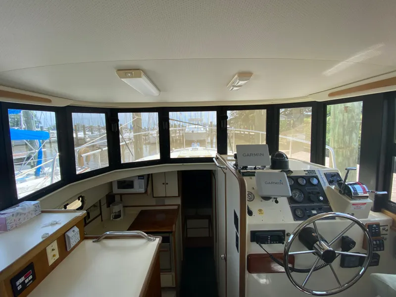 Slide: The Image of 1998 Camano Troll 31 boat interior with steering wheel and navigation equipment. - 44