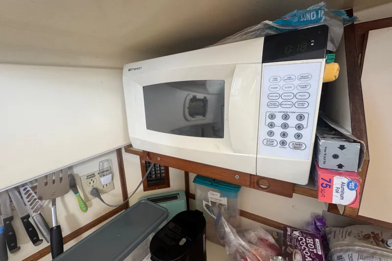 Slide: The Image of Microwave in 1998 Camano Troll 31 boat kitchen with utensils and storage. - 47