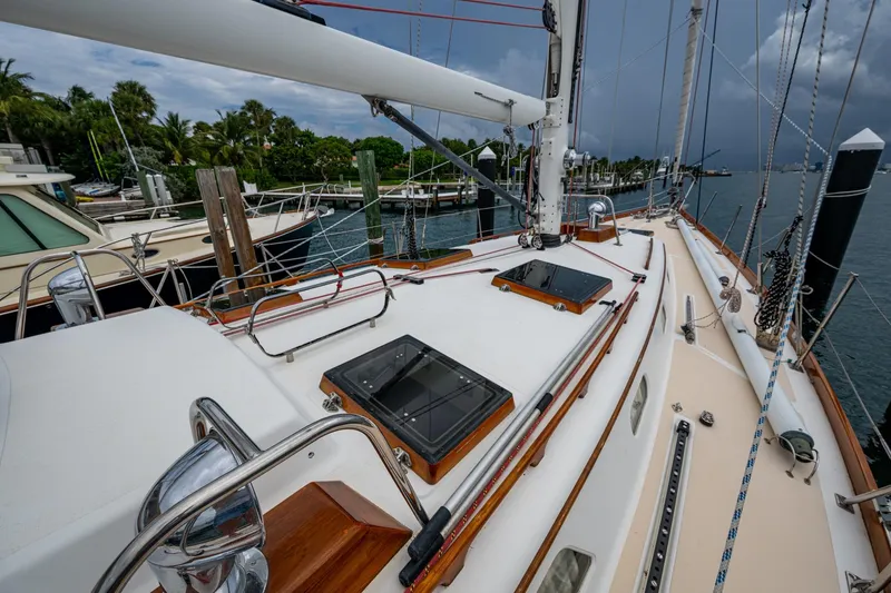Slide: The Image of Hinckley Sou'wester Stoway Sloop 2000 docked, showcasing deck and rigging details. - 10