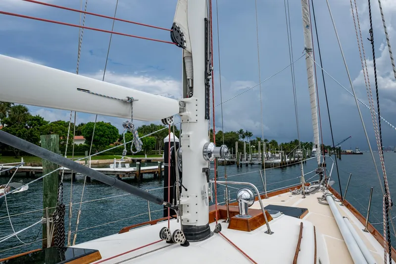 Slide: The Image of Hinckley Sou'wester Stoway Sloop 2000 sailboat docked, showcasing mast and rigging. - 11