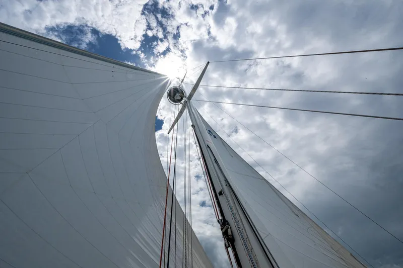 Slide: The Image of Sailboat mast and sails against cloudy sky, Hinckley Sou'wester Stoway Sloop, 2000. - 13