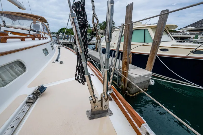 Slide: The Image of Hinckley Sou'wester Stoway Sloop 2000 docked, showcasing deck and rigging details. - 25