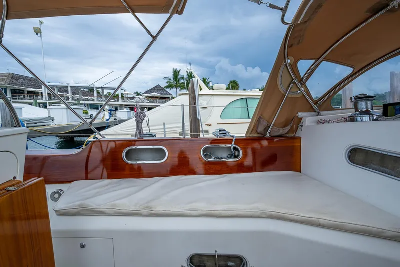 Slide: The Image of Hinckley Sou'wester Stoway Sloop 2000 cockpit with wooden trim and marina view. - 32