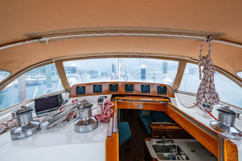 Slide: The Image of Interior view of 2000 Hinckley Sou'wester Stoway Sloop cockpit with navigation instruments and ropes. - 34