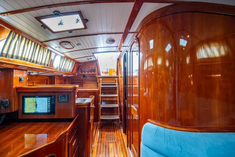 Slide: The Image of Luxurious interior of 2000 Hinckley Sou'wester Stoway Sloop with polished wood and navigation equipment. - 35