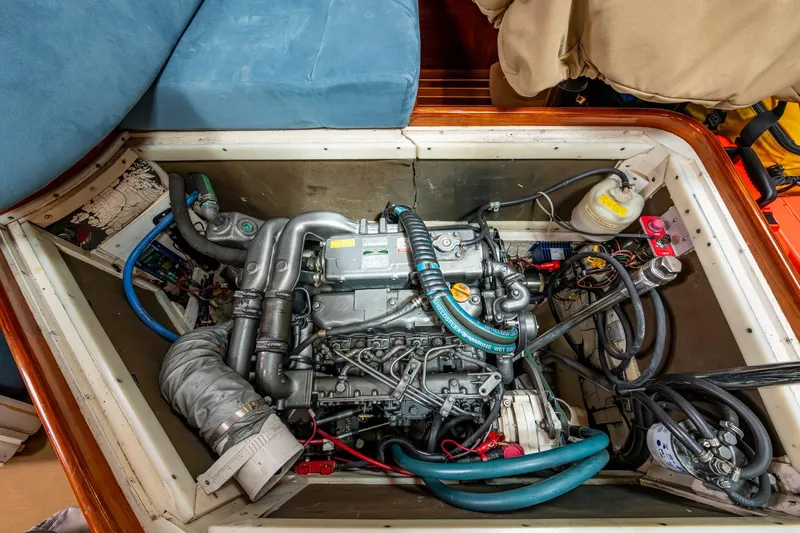 Slide: The Image of Engine compartment of 2000 Hinckley Sou'wester Stoway Sloop, showcasing detailed mechanical components. - 63