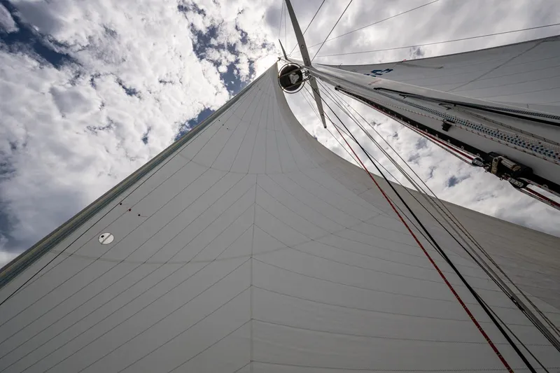 Slide: The Image of Sail of 2000 Hinckley Sou'wester Stoway Sloop against cloudy sky. - 12