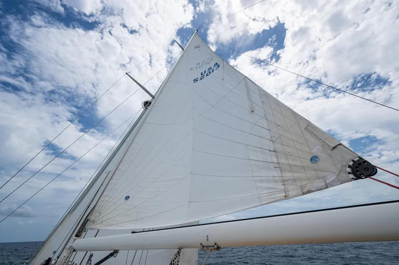 Slide: The Image of Sailing on a 2000 Hinckley Sou'wester Stoway Sloop under a partly cloudy sky. - 15