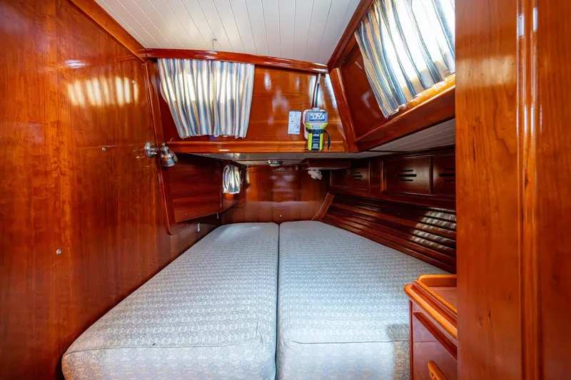 Slide: The Image of Cozy cabin interior of 2000 Hinckley Sou'wester Stoway Sloop with polished wood finish. - 43