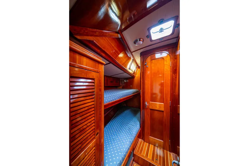 Slide: The Image of Luxurious wooden interior of 2000 Hinckley Sou'wester Stoway Sloop with cozy bunk beds. - 51